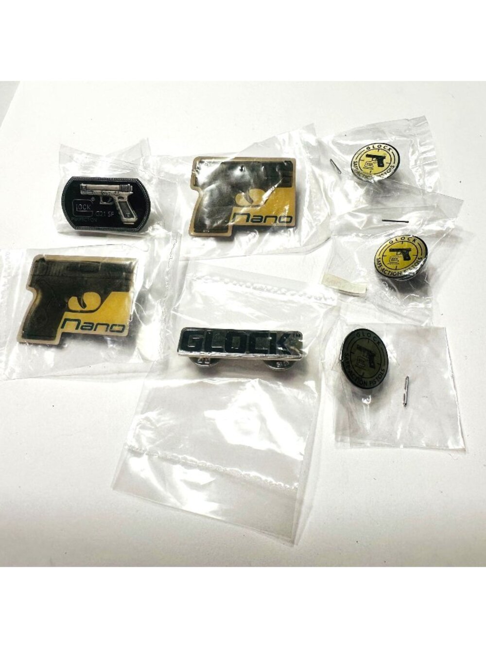 Lot Of Glock & Nano Pistol-Themed Lapel Pins New in packaging